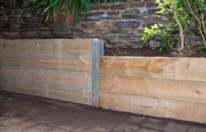 how-to-build-a-sleeper-retaining-wall-with-steel-posts-steel-builders